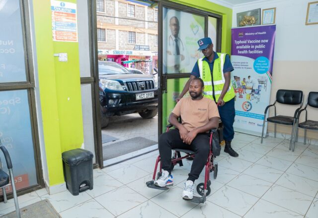 Staff assisting a patient arriving at Josma Health
