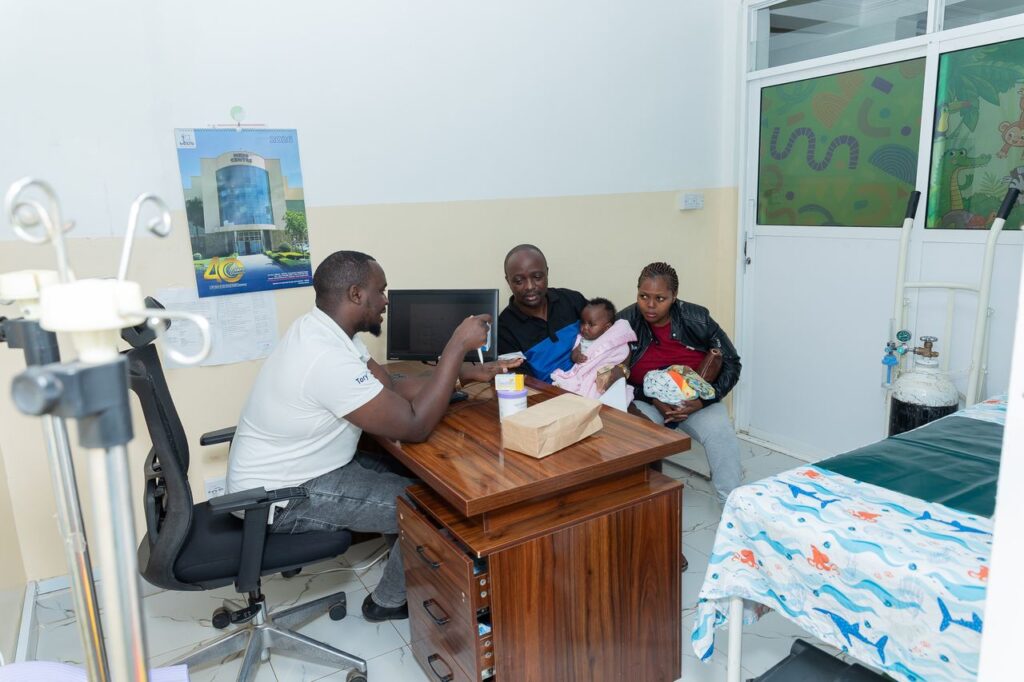 Clinicians consulting with a parent and baby at Josma Health