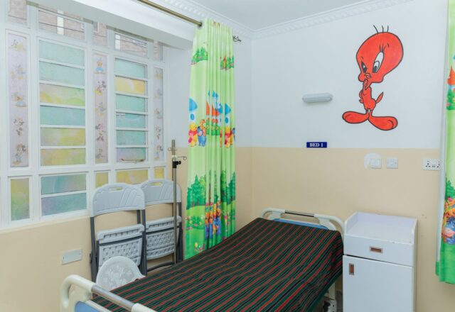 Bright children's ward with cartoon curtains at Josma Health